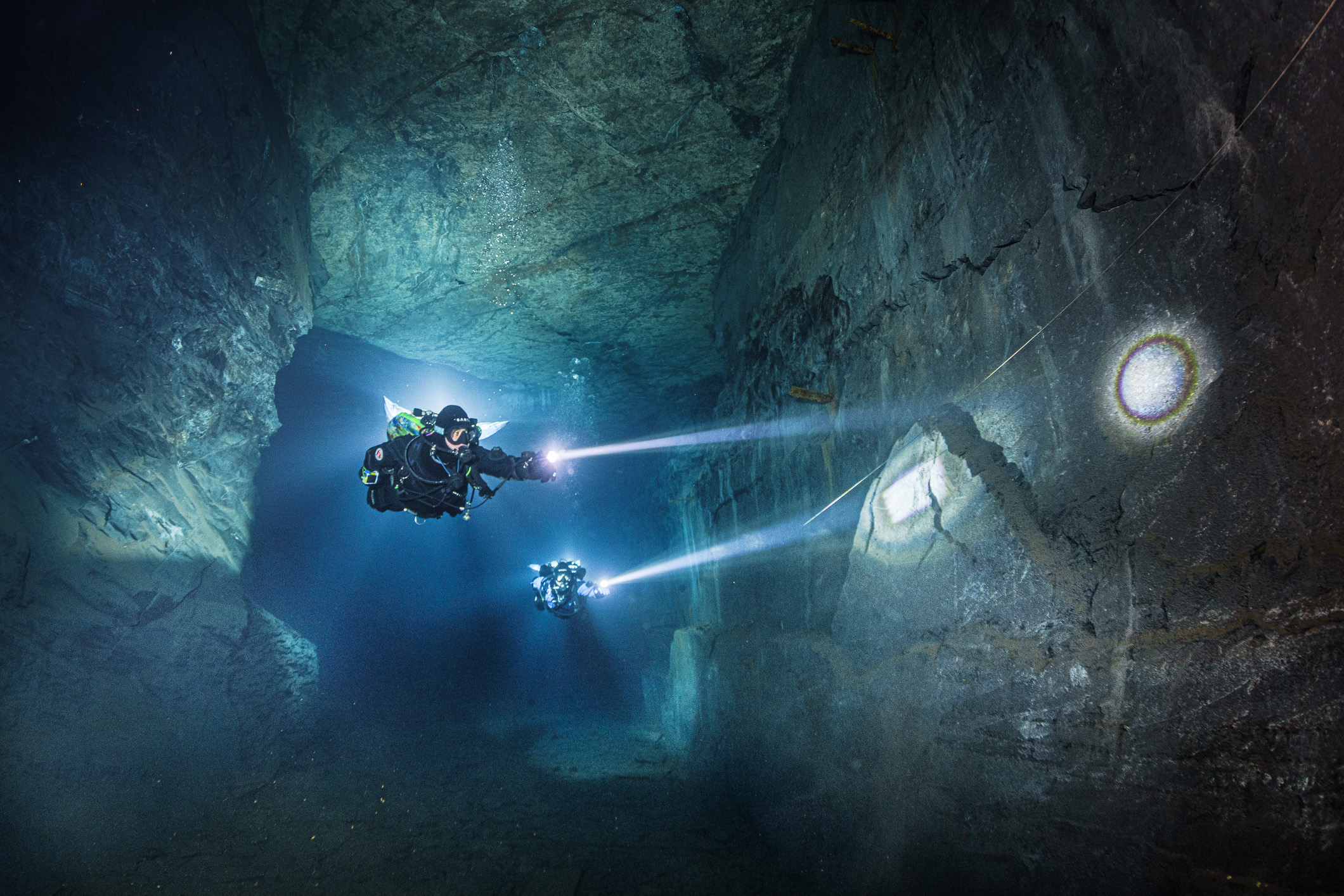 Cinematic underwater scene with diver and sculptural light